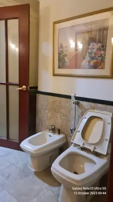 a bathroom with a toilet and a bidet at Regal Servies Suites at Times Square KL in Kuala Lumpur
