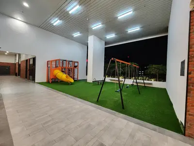 an empty room with a playground with a slide at Chambers Suites KLCC Serviced Apartment in Kuala Lumpur