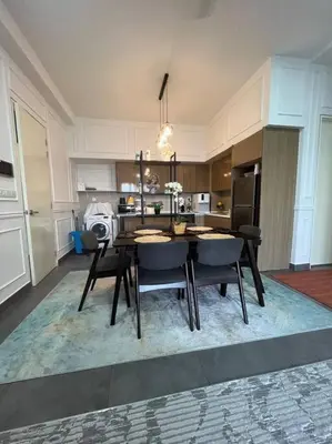 a kitchen with a table and chairs in a room at Elisa Sentrio Pandan Suites in Kuala Lumpur