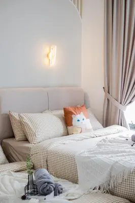 two beds sitting next to each other in a bedroom at M Vertica KL Residence Tower E by Feel Home in Kuala Lumpur