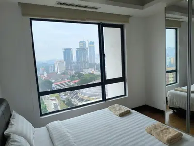 a bedroom with two beds and a large window at 021-6 Sweet Home-Casa Residency in Kuala Lumpur