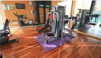 a gym with several tread machines in a room at 021-6 Sweet Home-Casa Residency in Kuala Lumpur