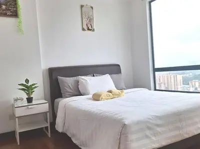 a bed with two towels on it in a bedroom at 021-6 Sweet Home-Casa Residency in Kuala Lumpur