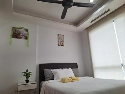 a bedroom with a bed with two towels on it at 021-6 Sweet Home-Casa Residency in Kuala Lumpur