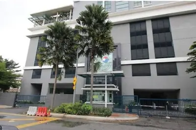a building with palm trees in front of it at 021-6 Sweet Home-Casa Residency in Kuala Lumpur