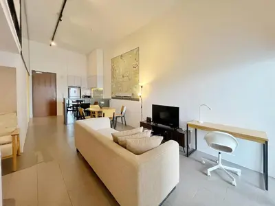 a living room with a couch and a tv at Nana'S at EST Bangsar KL Sentral Gem Loft in Kuala Lumpur