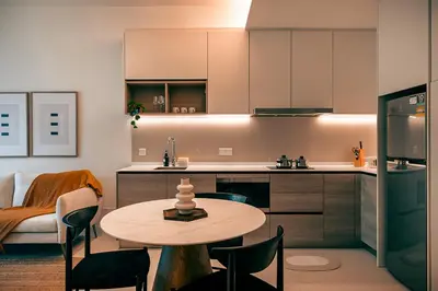 a kitchen with a table and chairs in a room at ViiA Residence, Mid Valley KL in Kuala Lumpur