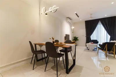a dining room with a table and chairs at Quill City Residences KLCC, Five Senses in Kuala Lumpur