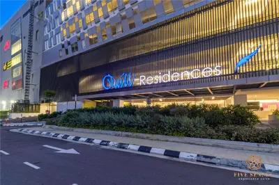 a building with a sign on the side of it at Quill City Residences KLCC, Five Senses in Kuala Lumpur