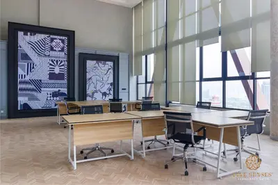 a conference room with tables and chairs and windows at Scarletz Signature Suites, KLCC in Kuala Lumpur