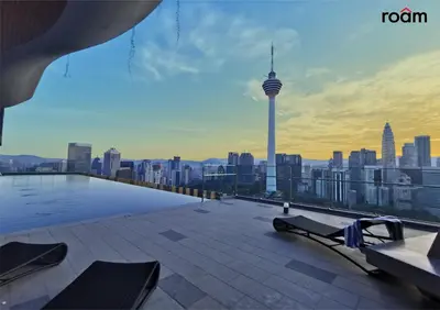 a rooftop pool with a view of a city at Ceylonz Signature Suites, Bukit Bintang in Kuala Lumpur