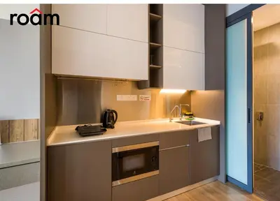 a kitchen with a sink and a microwave at Ceylonz Signature Suites, Bukit Bintang in Kuala Lumpur