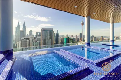 a swimming pool on top of a building with a city skyline at The Colony & The Luxe Signature Suites, KLCC in Kuala Lumpur