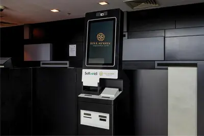 an atm machine with a sign on it in a room at Dua Sentral Signature Suites in Kuala Lumpur