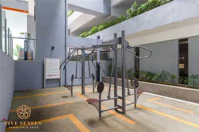 a row of gym equipment in a building at Neu Suites Signature Suites, KLCC in Kuala Lumpur
