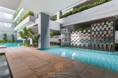 an internal view of a building with a swimming pool at Neu Suites Signature Suites, KLCC in Kuala Lumpur