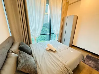 a bedroom with a bed and a couch and a window at Opus Residence KL 118 Chinatown by \u54c1\u5c4b PINWU Shortstay in Kuala Lumpur
