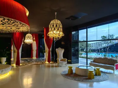 a lobby with chandeliers and a couch and a table at Arte Mont Kiara MITEC Publika MATRADE kuala lumpur 1R2B 4 Pax in Kuala Lumpur