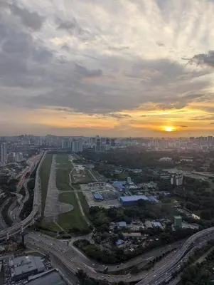 an aerial view of a city at sunset at Cozy Skyline Retreat at Trion KL, Level 63 in Kuala Lumpur