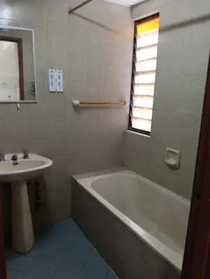 a bathroom with a bath tub and a sink at EMPRESS SIGNATURE in Kuala Lumpur