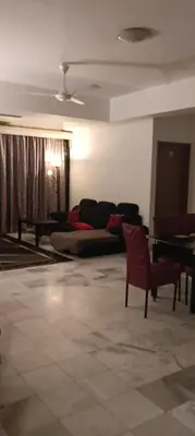 a living room with a couch and a table at EMPRESS SIGNATURE in Kuala Lumpur