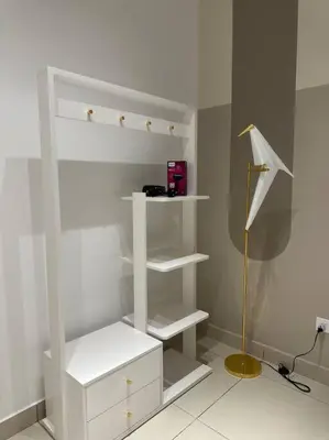 a white closet with white shelves and a lamp at Trion KL Family Condotel TRX KLCC MRT in Kuala Lumpur