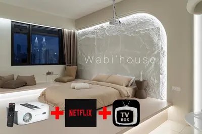 a bedroom with a bed and a sign that reads watch house at Chambers Suites KL by Wabi Wood's House in Kuala Lumpur