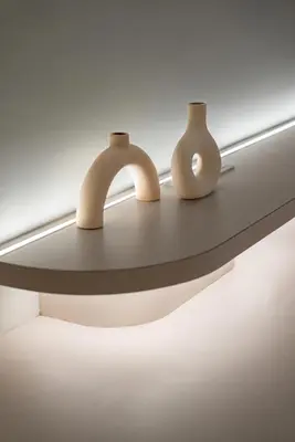 two vases are sitting on a glass shelf at Chambers Suites KL by Wabi Wood's House in Kuala Lumpur