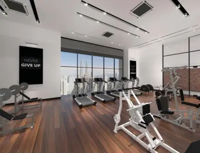 a gym with a bunch of exercise equipment in a room at Chambers Suites KL by Wabi Wood's House in Kuala Lumpur