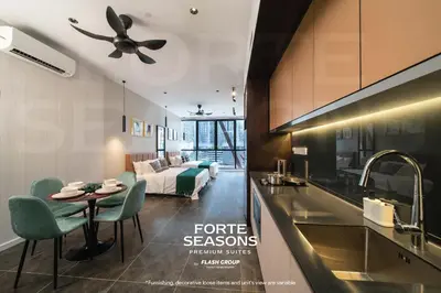 a kitchen and a living room with a table and a couch at Forte Seasons Scarletz Premium Suites @ KLCC in Kuala Lumpur