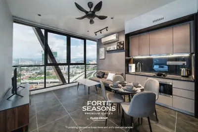 a kitchen and living room with a table and chairs at Forte Seasons Scarletz Premium Suites @ KLCC in Kuala Lumpur