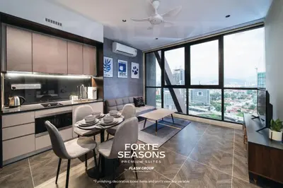 a kitchen with a table and chairs in a room at Forte Seasons Scarletz Premium Suites @ KLCC in Kuala Lumpur