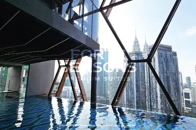 a view of the empire state building from the top of a skyscraper at Forte Seasons Scarletz Premium Suites @ KLCC in Kuala Lumpur