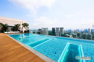 a swimming pool on the roof of a building at Infinity SkyPool - KL Suite KL Sentral Brickfield by GoMain in Kuala Lumpur