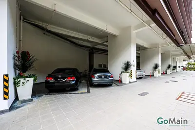 two cars are parked in a garage at Infinity SkyPool - KL Suite KL Sentral Brickfield by GoMain in Kuala Lumpur