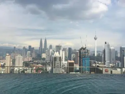 a view of a city skyline from the water at Modern Studio @ Kuala Lumpur, Regalia Residence in Kuala Lumpur