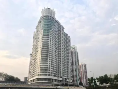 a tall white building with a sky at Modern Studio @ Kuala Lumpur, Regalia Residence in Kuala Lumpur