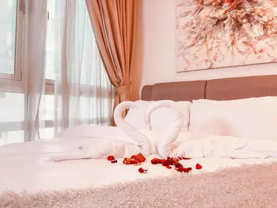 a bed with two swans forming a heart at 6 PAX, Studio, 3mins to KLCC (3A01) in Kuala Lumpur