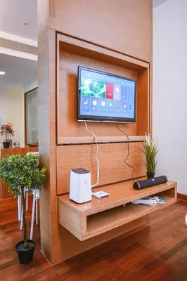 a living room with a tv on a wall at 6 PAX, Studio, 3mins to KLCC (3A01) in Kuala Lumpur