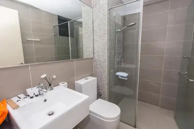 a bathroom with a toilet and a sink and a shower at V Residence at Sunway Velocity by MY TRIP & MY STAY in Kuala Lumpur