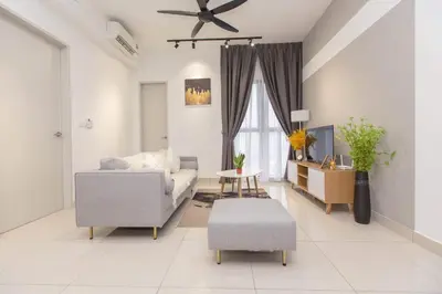 a living room with a couch and a ceiling fan at Trion KL city centre near KLCC & TRX by MY TRIP & MY STAY in Kuala Lumpur