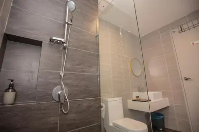a bathroom with a shower and a toilet at Trion KL city centre near KLCC & TRX by MY TRIP & MY STAY in Kuala Lumpur