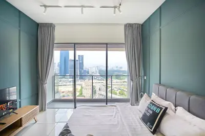a bedroom with a bed and a large window at Continew Residence TRX KL in Kuala Lumpur