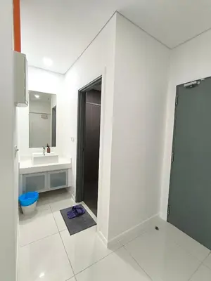 a bathroom with a shower and a sink and a toilet at Mercu summer Suites by KL Residence in Kuala Lumpur