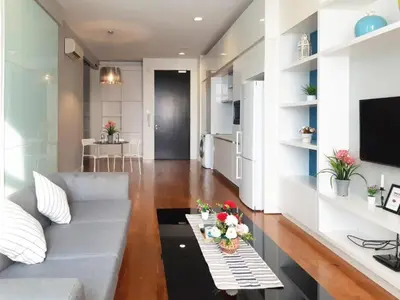 a living room with a couch and a table at PLATINUM Suites KLCC By AR Hospitality in Kuala Lumpur