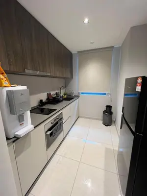 a kitchen with a stove and a refrigerator at Datum Jelatek - KLCC Sky Ring Linked To LRT & Mall by AwNa in Kuala Lumpur