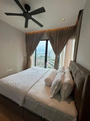 a bedroom with a bed with a ceiling fan at Datum Jelatek - KLCC Sky Ring Linked To LRT & Mall by AwNa in Kuala Lumpur