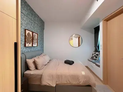 a small bedroom with a bed with a mirror at 2BR, 7PX The Colony@Near Quill CityMall & Monorail in Kuala Lumpur