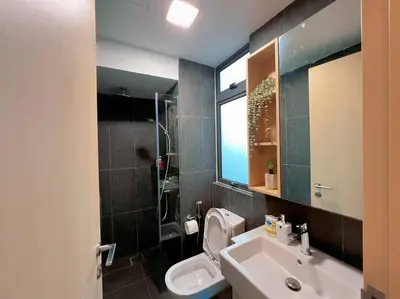 a bathroom with a sink and a toilet and a window at Duplex 4px@Colony, Near Quill CityMall & Monorail in Kuala Lumpur