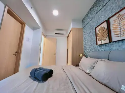 a bedroom with a bed with a hat on it at Duplex 4px@Colony, Near Quill CityMall & Monorail in Kuala Lumpur
